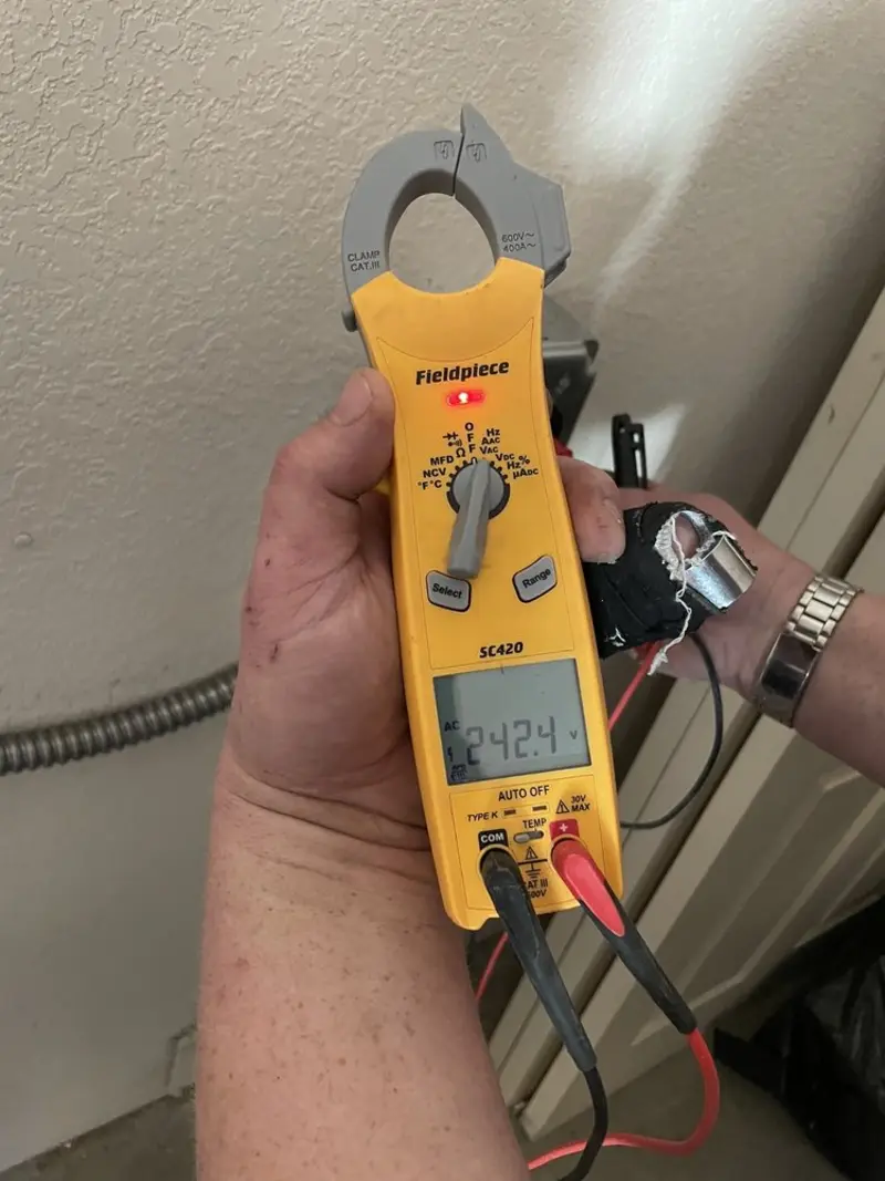 Voltage testing with clamp meter during Electrical Installation Services in Kankakee